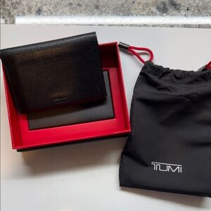 Tumi Black Leather Bifold Wallet with Branded Drawstring Pouch